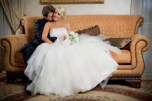 Selecting the perfect wedding dress. Bride in beautiful white wedding dress. WedSafe