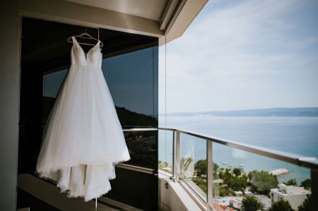 A white dress on a window    Description automatically generated with low confidence