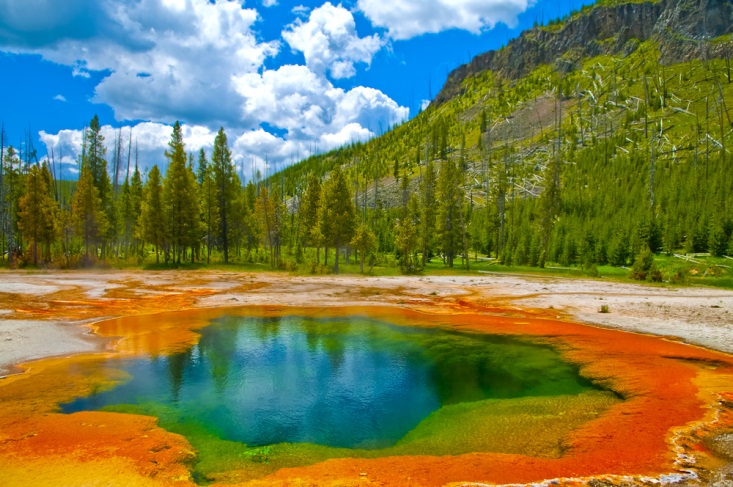 Colorful natural lake and mountainside in Yellowstone National Park